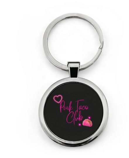 Round silver keychain with neon Pink Taco Club artwork